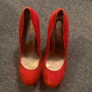 Red suede pumps